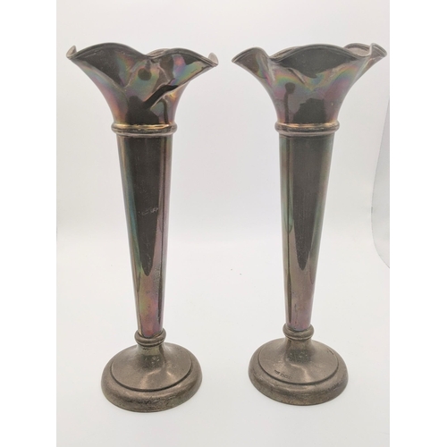 215 - A pair of silver weighted tulip vases, 24.5cm h
Location: R2.1

If there is no condition report show... 