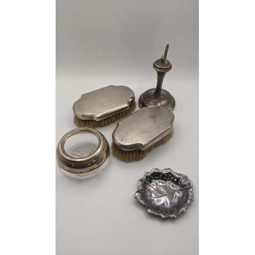 216 - Silver to include two dressing table brushes with engine turned design, a silver rimmed pot, a pin d... 