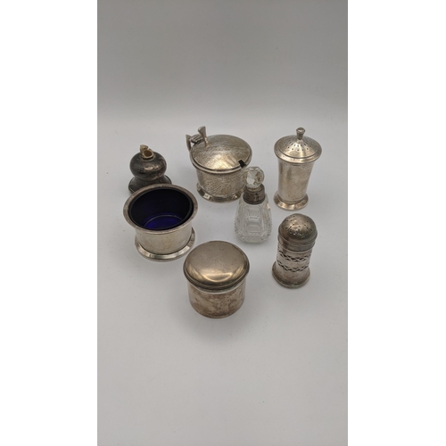 224 - Silver to include various condiment pots, two pepper pots, a crystal cut glass scent bottle and othe... 