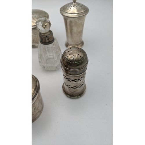 224 - Silver to include various condiment pots, two pepper pots, a crystal cut glass scent bottle and othe... 