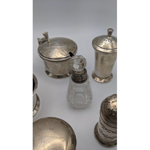 224 - Silver to include various condiment pots, two pepper pots, a crystal cut glass scent bottle and othe... 