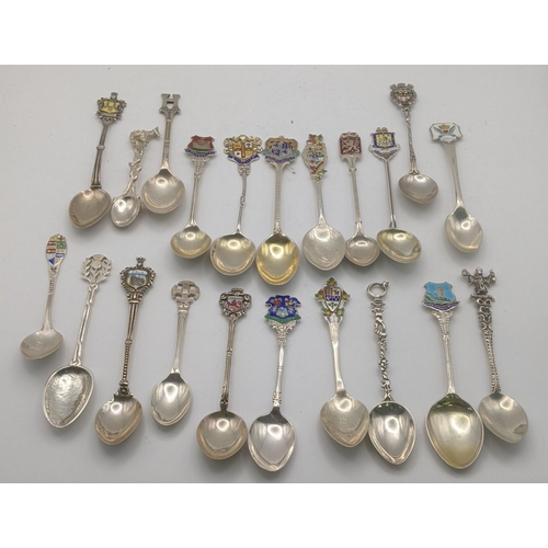 227 - A collection of silver and white metal collectors spoons to include silver spoons decorated with ena... 