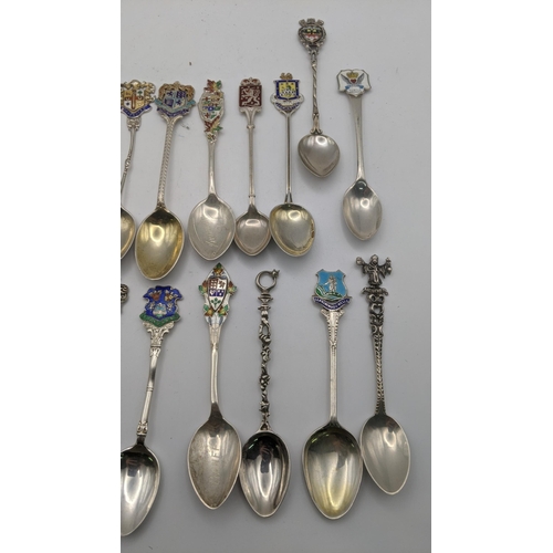 227 - A collection of silver and white metal collectors spoons to include silver spoons decorated with ena... 