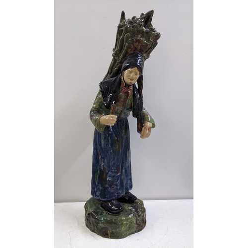 313 - A circa 1900 Majolica large figure fashioned as an elderly peasant lady, 47cm h
Location: 10.1

If t... 