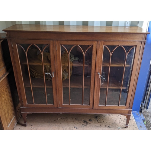 321 - An early 20th century mahogany three door glazed display cabinet on square tapering short legs 121.5... 