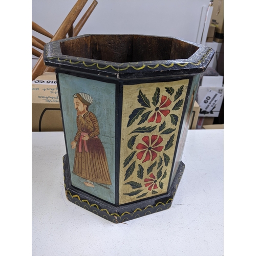 342 - An early 20th century octagonal planter with decorated repeating panels of gentleman in Asian dress ... 