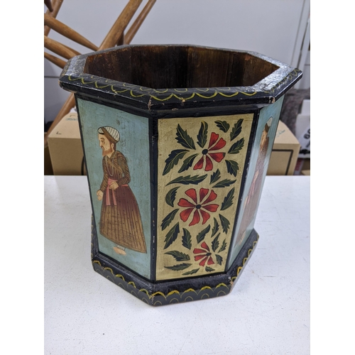 342 - An early 20th century octagonal planter with decorated repeating panels of gentleman in Asian dress ... 