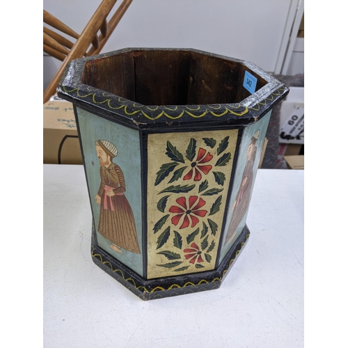 342 - An early 20th century octagonal planter with decorated repeating panels of gentleman in Asian dress ... 