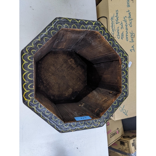 342 - An early 20th century octagonal planter with decorated repeating panels of gentleman in Asian dress ... 