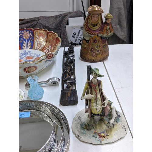 343 - A mixed lot to include a large Japanese Satsuma bowl, a model of a gentleman and dog standing with d... 