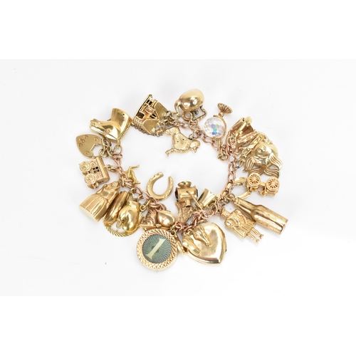 293 - A 9ct yellow gold chain link charm bracelet, with various 9ct gold charms including a matador, fish,... 