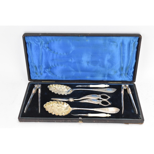 294 - A Victorian silver plated boxed fruit and nut set, comprising a pair of nut crackers, two picks with... 