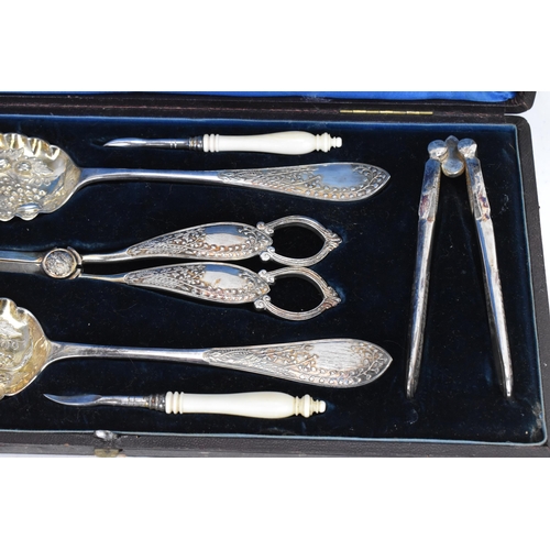 294 - A Victorian silver plated boxed fruit and nut set, comprising a pair of nut crackers, two picks with... 