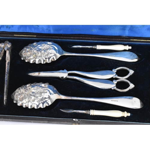 294 - A Victorian silver plated boxed fruit and nut set, comprising a pair of nut crackers, two picks with... 