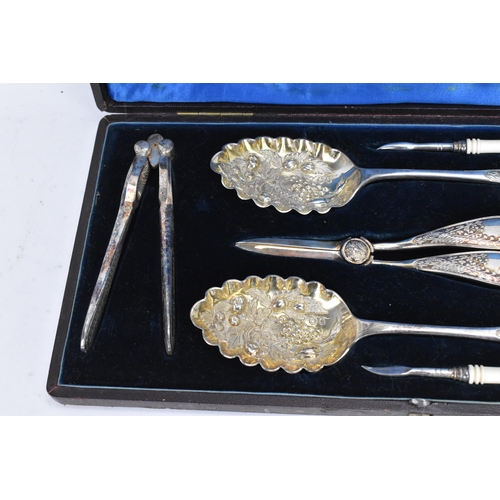 294 - A Victorian silver plated boxed fruit and nut set, comprising a pair of nut crackers, two picks with... 