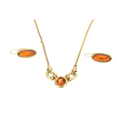 296 - A 14ct yellow gold and amber necklace with matching earrings, the necklace having a spiga chain with... 