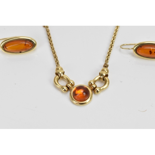 296 - A 14ct yellow gold and amber necklace with matching earrings, the necklace having a spiga chain with... 