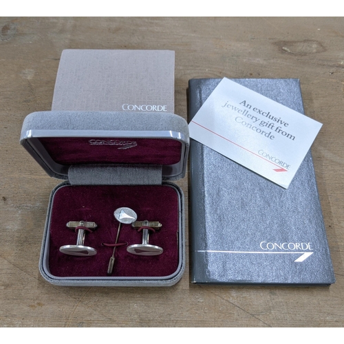 337 - Concorde related collectables to include a pair of cufflinks and a tie pin stamped 'Silver' embossed... 