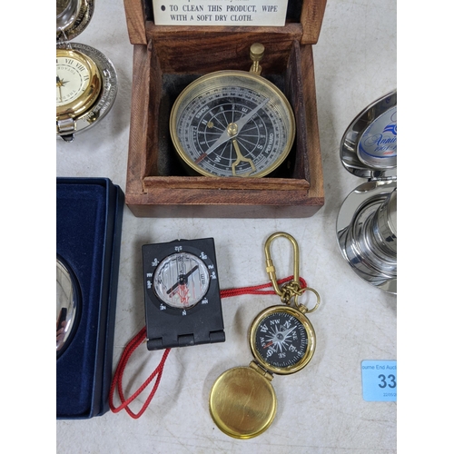 338 - Three compasses, one boxed, the Dalvey Voyager clock in a case, a collapsible pocket dram cup in a c... 