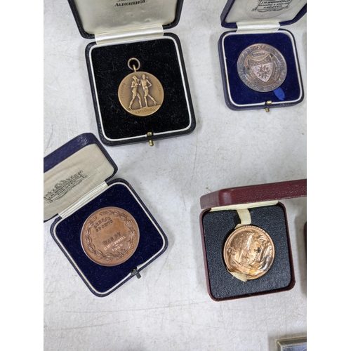 339 - School medals from Andover, most relating to D McConnell, one relating to A McConnell, three 1953 Br... 