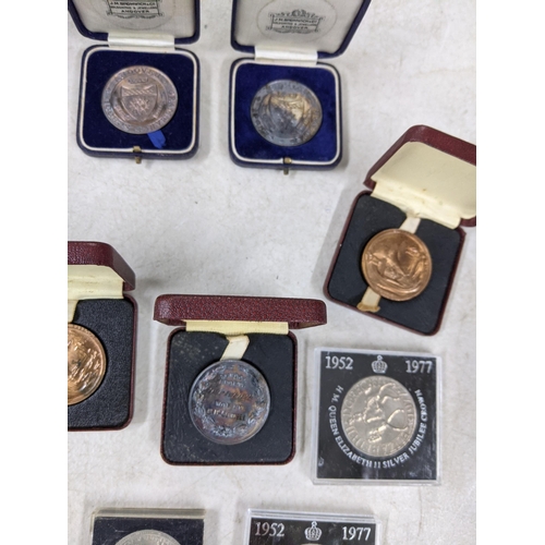 339 - School medals from Andover, most relating to D McConnell, one relating to A McConnell, three 1953 Br... 