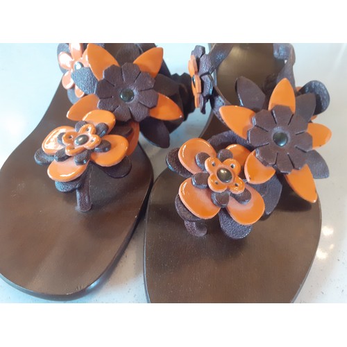 36 - Miu Miu- A pair of brown Vero Cuoio 'Bufalo Flow Coco-Manda' heeled sandals with brown and orange fl... 