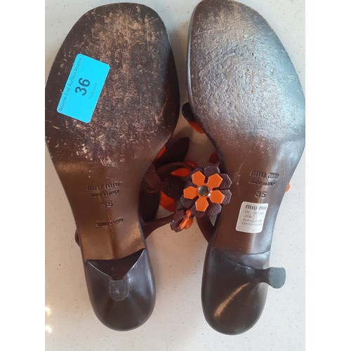 36 - Miu Miu- A pair of brown Vero Cuoio 'Bufalo Flow Coco-Manda' heeled sandals with brown and orange fl... 