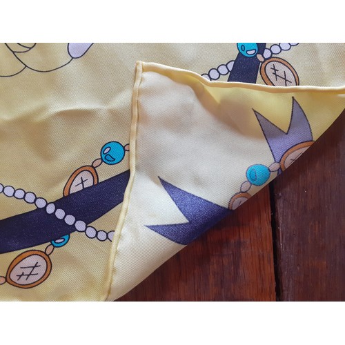 58 - Two late 20th Century scarves to include a yellow floral silk scarf with ribbon and bead design to t... 