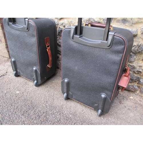 3 - Mulberry- A pair of Scotchgrain wheelie suitcases, one having a luggage tag with serial number on gi... 