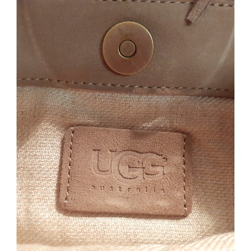 33 - Ugg and Donna Karan-An Ugg fold over handbag bag having a shimmering reptile design, chain strap and... 