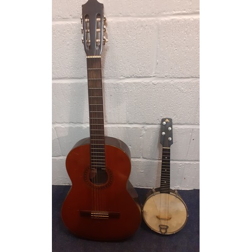 200 - A Kimbara acoustic 6-string guitar model no:N-27 together with a British Made Banjo A/F in case. Loc... 