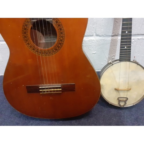 200 - A Kimbara acoustic 6-string guitar model no:N-27 together with a British Made Banjo A/F in case. Loc... 