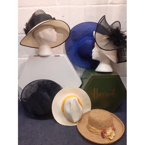 146 - A group of formal hats to include a Capelli Condici natural straw wide brim hat with black fabric ba... 