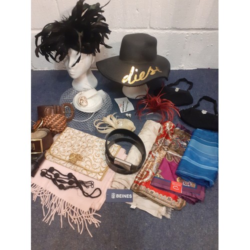 145 - A group of fascinators and accessories together with a Diesel black wide brimmed straw beach hat wit... 