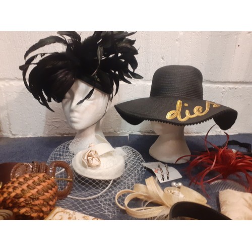 145 - A group of fascinators and accessories together with a Diesel black wide brimmed straw beach hat wit... 