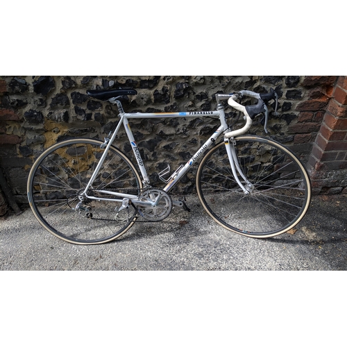 298 - A Pinarello Banesto racing bike, early 1990s in the Banesto colours original equipment, wit matching... 