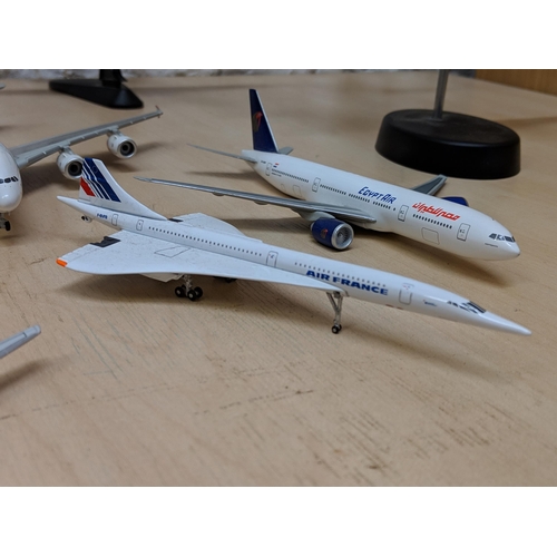 26 - Nine aircrafts - Four military planes to include a Tamiya 1/48 plastic model kit Grumman F-14A Tomca... 