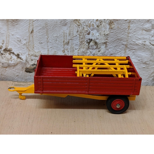 5 - Corgi Toys, a Massey-Ferguson tractor with shovel, along with a Farm Tipper trailer 69 and 62 boxed ... 