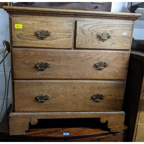 263 - An oak Georgian style chest of drawers of small proportions, two short and two long graduated drawer... 