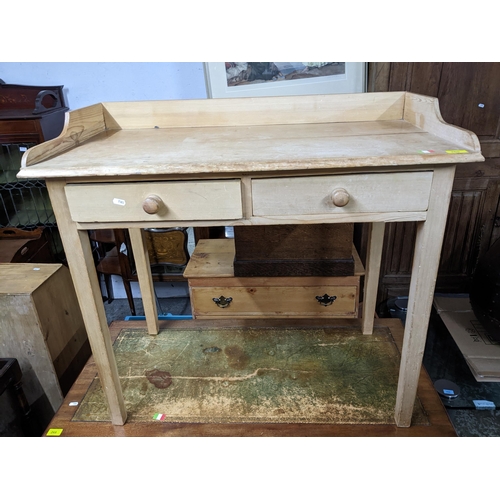 265 - A 19th century pine wash stand with galleried top over two drawers on square tapered legs 83.5cm x 9... 