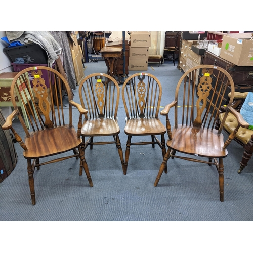 282 - Two Windsor wheelback carver chairs and two matched standard dining chairs Location:A4B
If there is ... 