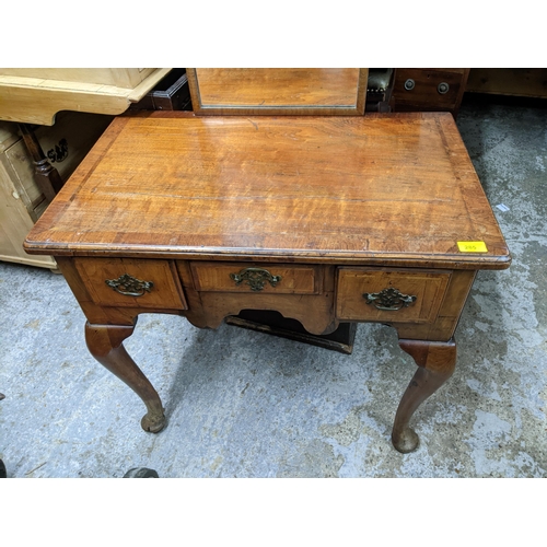 285 - An 18th century and later walnut lowboy with three drawers, on cabriole legs, 69cm x 76cm x 47.5cm, ... 