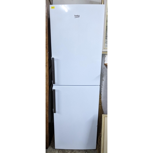 314 - A Beko fridge freezer 191cm x 59cm x 61.5cm Location:G
If there is no condition report shown, please... 