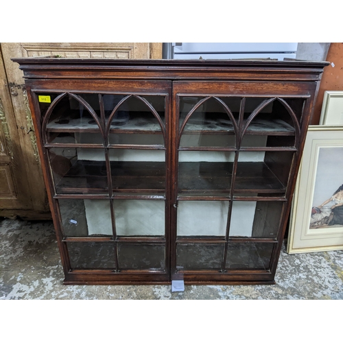 315 - A 19th century mahogany bookcase (top half of a bureau bookcase) mounted for wall hanging, twin astr... 