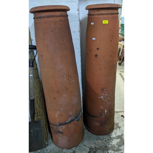 318 - Two Victorian tall terracotta chimney pots, 125cm tall Location:G
If there is no condition report sh... 