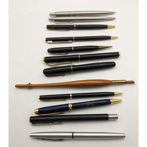 104 - A mixed lot of pens to include a Parker ballpoint pen and propelling pencil & various ballpoint and ... 