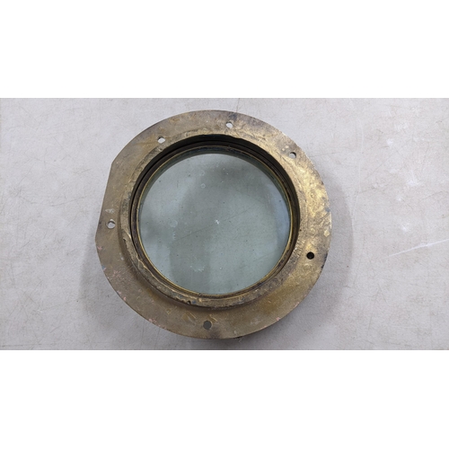 134 - A 20th century cast bronze ships port hole with a hinged glazed doors, 35cm dia
Location: A4B

If th... 