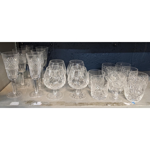 136 - A selection of Waterford crystal glassware to include brandy glasses, champagne flutes and others
Lo... 