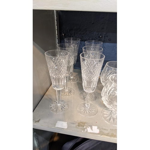 136 - A selection of Waterford crystal glassware to include brandy glasses, champagne flutes and others
Lo... 