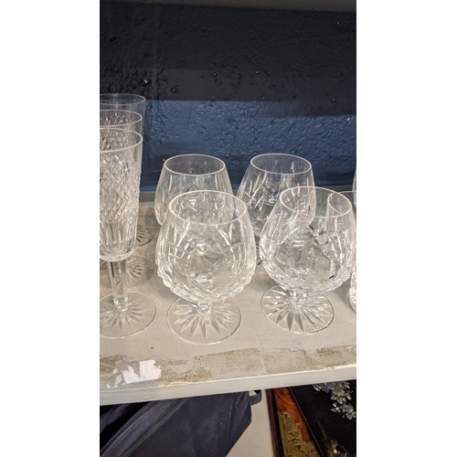 136 - A selection of Waterford crystal glassware to include brandy glasses, champagne flutes and others
Lo... 